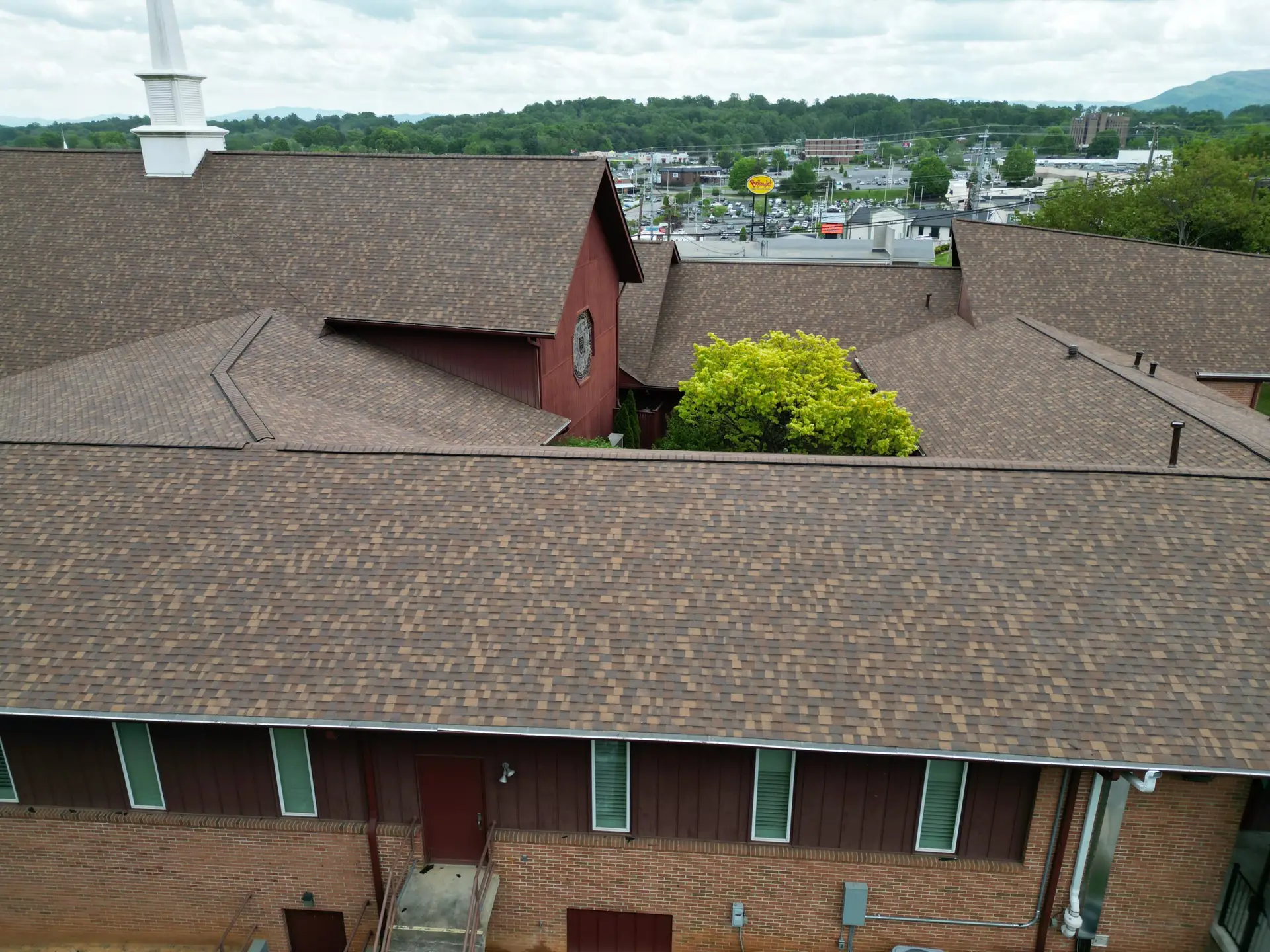 New roof across a multi-wing church building in Johnson City, TN