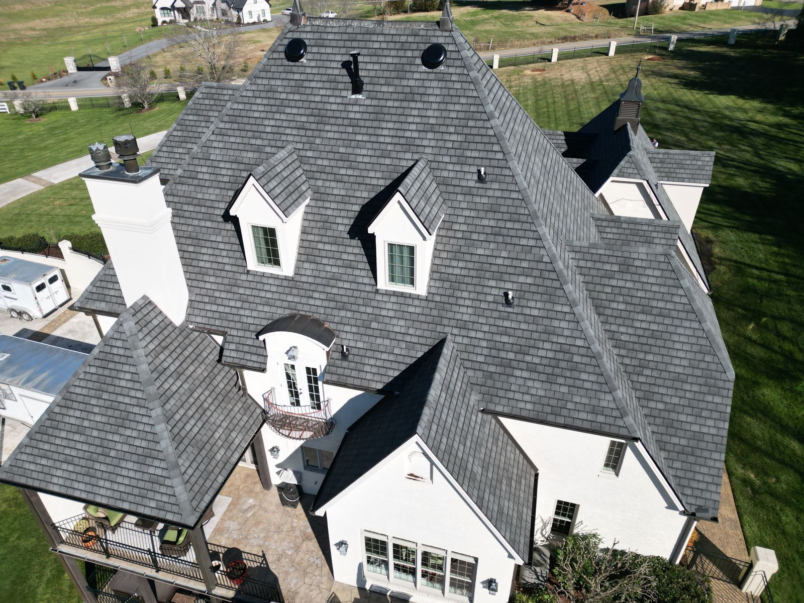 Drone view of a steep complex dormer roof