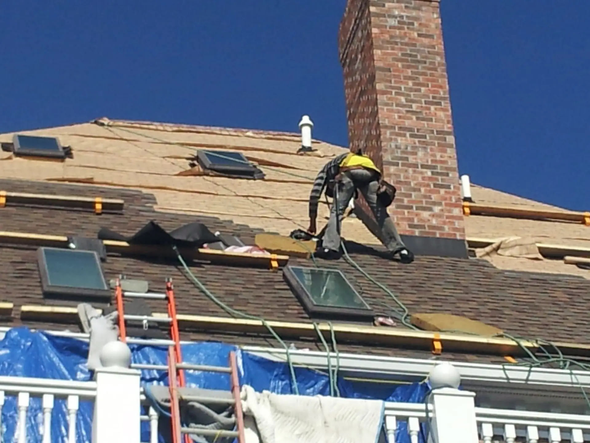 Whittington Construction roofer installing a skylight during a roof replacement