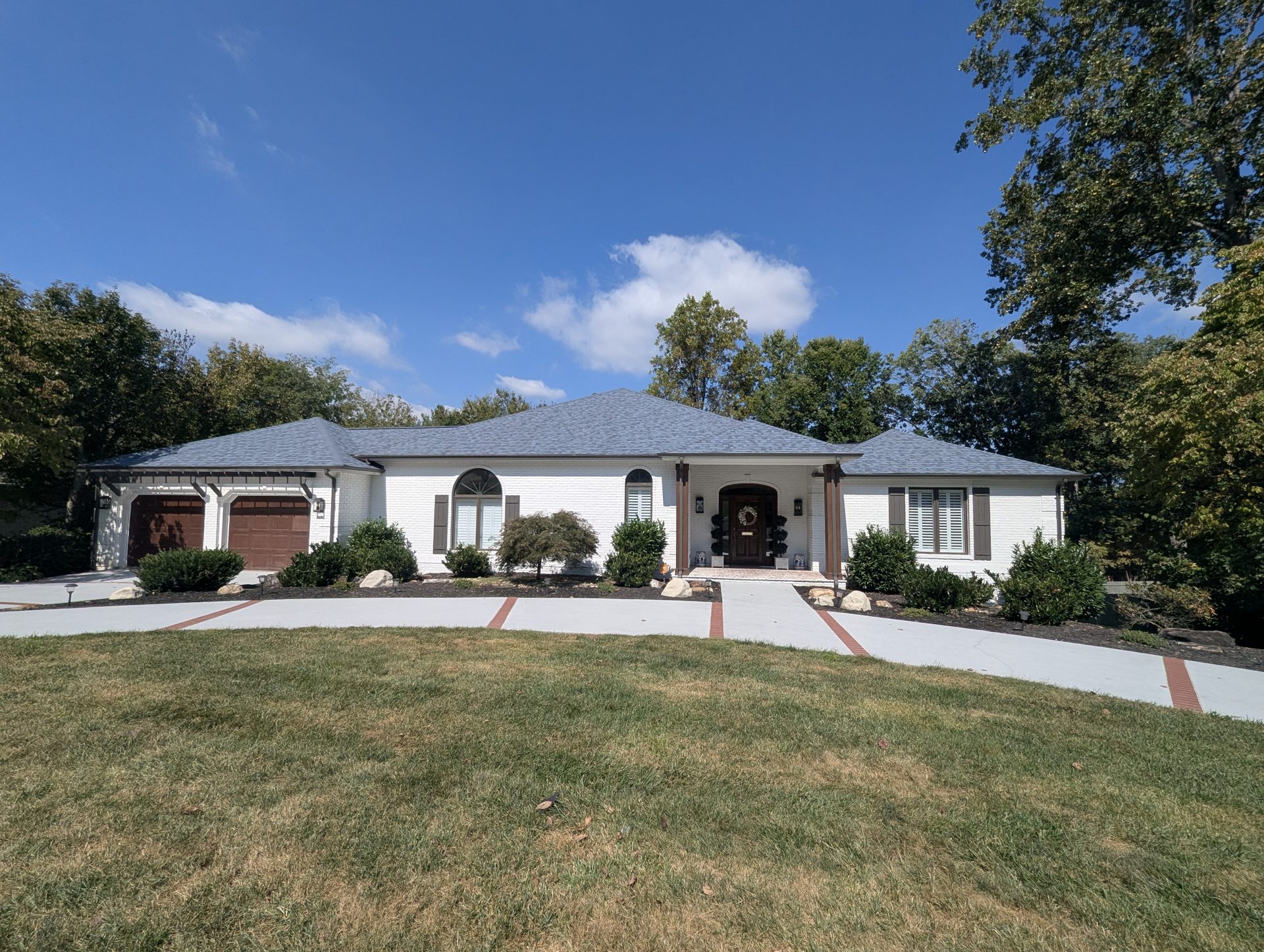 New Owens Corning roof on a white brick home in the Shadowood neighborhood of Johnson City, TN